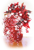 Red lovely vase with tootsie rolls
